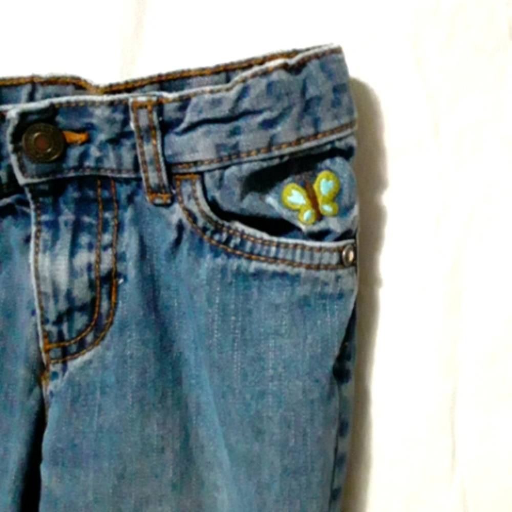 Carter's 3T denim jeans with butterflies on front and back pockets.